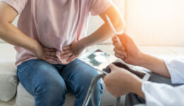 Abdominal Pain Patient Woman Having Medical Exam With Doctor On