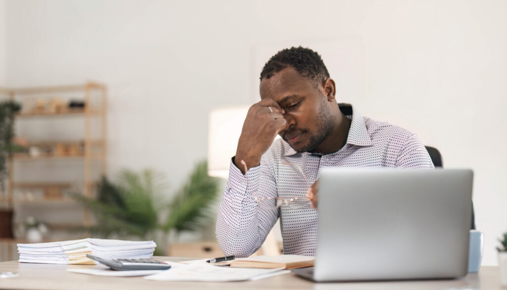 African American Man Having Difficulty Concentrating Due to Low Testosterone